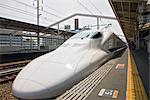 A Nozomi style Shinkansen train, otherwise known as a bullet train in Himeji Station, Himeji, Japan