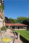 Traditional Arts and Crafts house. Sun terrace looking to pool house. Architects: Attributed to A.R.Calvert, c 1880