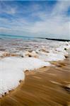 Sea washing in onto sandy beach