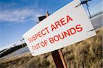 Signs on beach on East Falkland warning of dangers of unexploded mines and mine fields