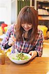 Woman Enjoying Lunch In Cafe