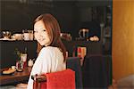 Japanese Woman Relaxing in Café