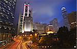 Traffic passing along Queen's Road Central at dusk with HSBC building in background, Central, Hong Kong, China