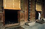 China, Shaanxi Province, Xian. A Muslim man steps into Xian's Great Mosque, the largest in China, established in the C8th