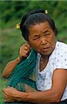 China, Guizhou Province, nr Rongjiang. A Dong minority woman with a comb wedged into her bun.
