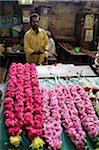 India, Tamil Nadu, Madurai. Flower garland maker at the Minakshi Sundareshvara Temple.