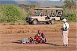 Kenya, In the afternoo tourists enjoy a  sundowner  drink on the banks of the Uaso Nyiru in Northern Kenya.