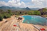 Kenya, The natural rock swimming pool of Sarara Camp, a luxurious ecolodge situated near the Mathews Mountains