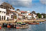 Kenya. Lamu s busy waterfront with ancient cast-iron canons guarding the harbour.