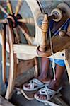 Kenya, Laikipia, Lewa Downs.  A local Laikipiak Maasai woman spins wool to make carpets at Wilderness Trails community workshop.