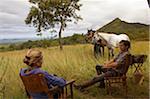 Kenya, Chyulu Hills, Ol Donyo Wuas. Couple on a horse riding safari with Ride Africa in the Chyulu Hill.