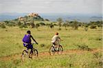 Kenya, Chyulu Hills, Ol Donyo Wuas. A Maasai guide and boy on a mountain biking safari.