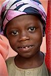 Mozambique, Ihla de Moçambique, Stone Town. A young muslim boy smiles at the camera