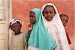 Mozambique, Ihla de Moçambique, Stone Town. A group of Muslim children stand outside their school