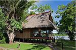 Peru. A thatched bedroom cottage Peru, Inkaterra Reserva Amazonica Lodge on the banks of the Madre de Dios River.