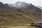 Peru, Scenery in the high Andean Mountains from the comfort of the  Andean Explorer  express train that runs between Cusco and Puno.