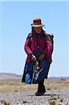 Peru, An old shepherdess in the bleak altiplano of the high Andes between Arequipa and the Colca Canyon.