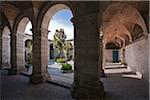 Peru, Vaulted walkways around a courtyard garden in the magnificent Santa Catalina Convent, founded in 1580.