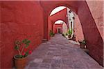 Peru, Bright red walls of a passageway in the magnificent Santa Catalina Convent, founded in 1580.