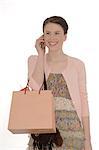 Woman holding shopping bag on the phone