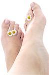 Woman with daisies among her toes