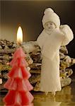 Christmas decoration with figurine and candle