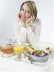 Woman sitting at breakfast table