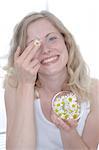 Woman holding bowl with marguerite blossoms