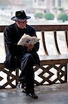 China, Guizhou Province, Taijiang, old man reading a newspaper