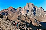 Kenya. Climbers traverse a ridge towards the peaks of Mount Kenya.