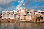 Kenya, Mombasa. Modern buildings and a mosque along the water front of the old dhow harbour in Mombasa.