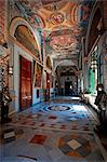 Malta, Valetta, knights armour decorates one of the halls of the Grand Palace together with richly decorated floor and ceiling.