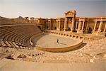 Syria, Palmyra. A tourist walks around the  amphitheatre part of Queen Zenobia's Roman city at Palmyra.