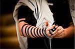 Close-Up of Rabbi Laying Tefillin