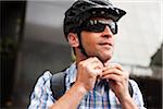 Man Fastening Bike Helmet