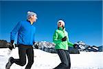 Couple Running Outdoors in Winter