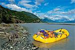 View of a raft packed with gear on Chive Beach on the Tatshenshini River, Tatshenshini-Alsek Provincial Park, British Columbia Canada, Summer