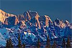 Sunrise alpenglow on the Mooses Tooth in in the Alaska Range, Denali State Park,  Southcentral Alaska, Spring