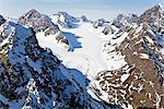 Aerial view of the Chugach Mountains that overlook the East and West forks of Eklutna Glacier, Chugach State Park, Southcentral Alaska, Spring