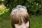 Girl wearing tiara and winking