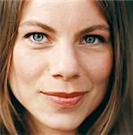 Close-up of a smiling woman's face.