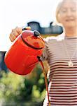 A woman pouring coffee.