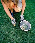 a woman cleaning weed.