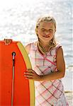Portrait of a girl with a surf board.