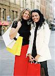Two women with shopping bags, Stockholm Sweden.