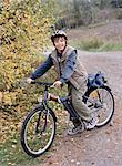 A boy with his bicycle.