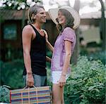 Young couple laughing, Thailand.