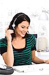 A woman with headset in an office.