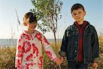 Young boy and girl holding hands, portrait