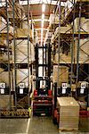 Forklift moving pallets in warehouse